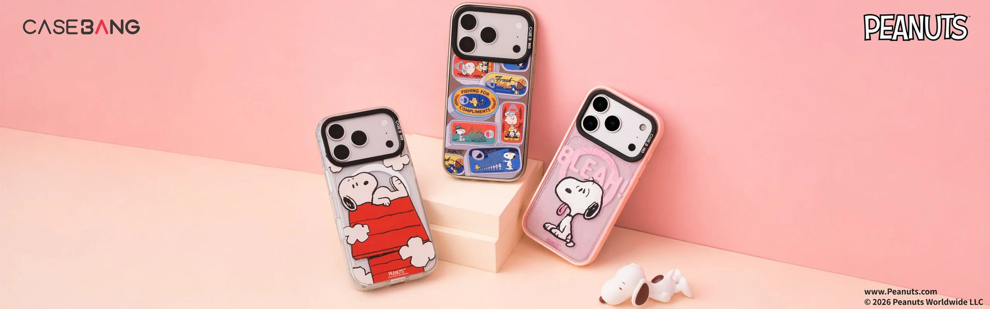 CaseBang x Peanuts collaboration snap-on phone cases featuring Snoopy red house, fishing stickers, and BLEAH designs on pink background